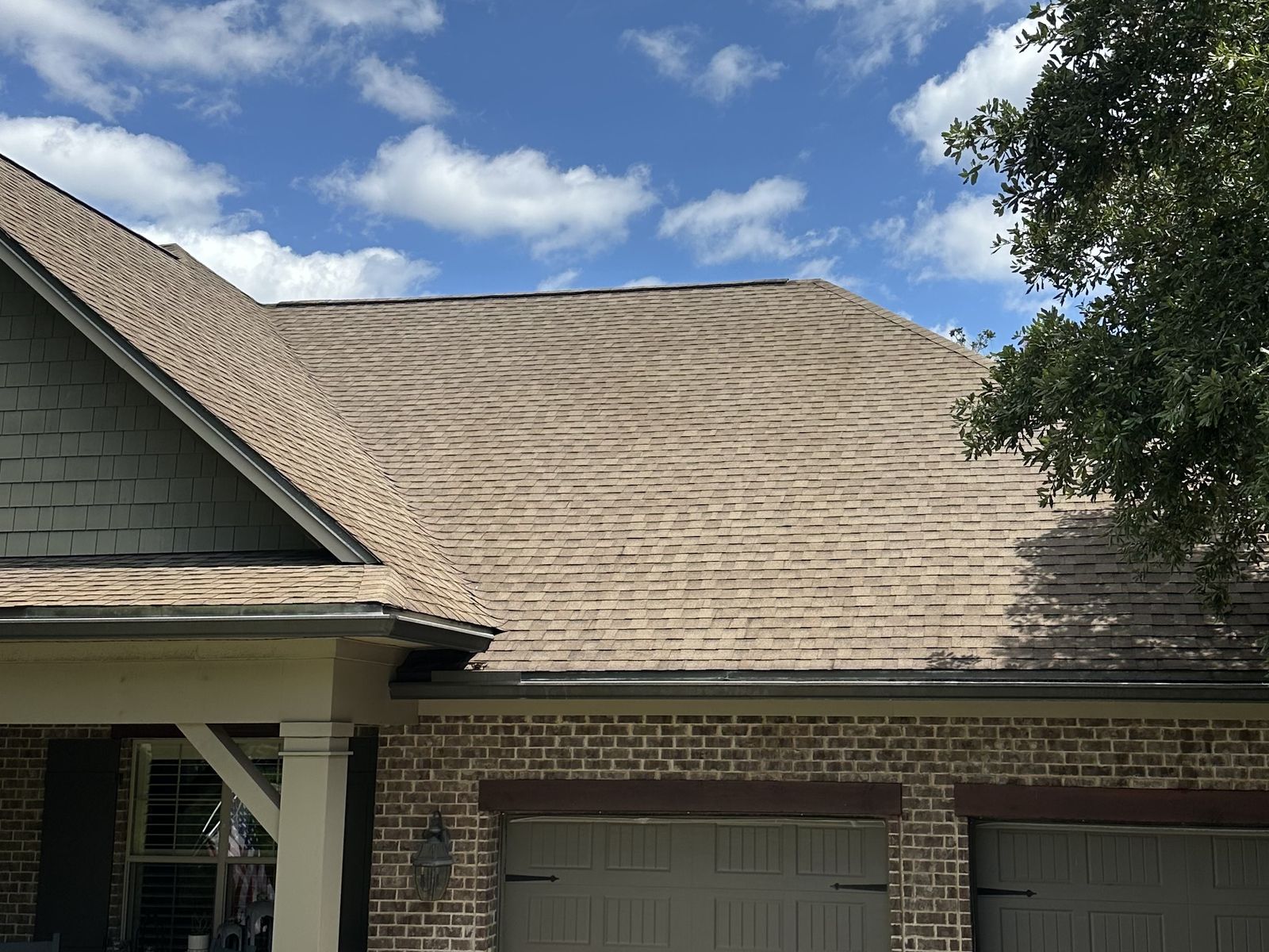 Asphalt shingle roof after soft wash roof washing, black algae streaking removed