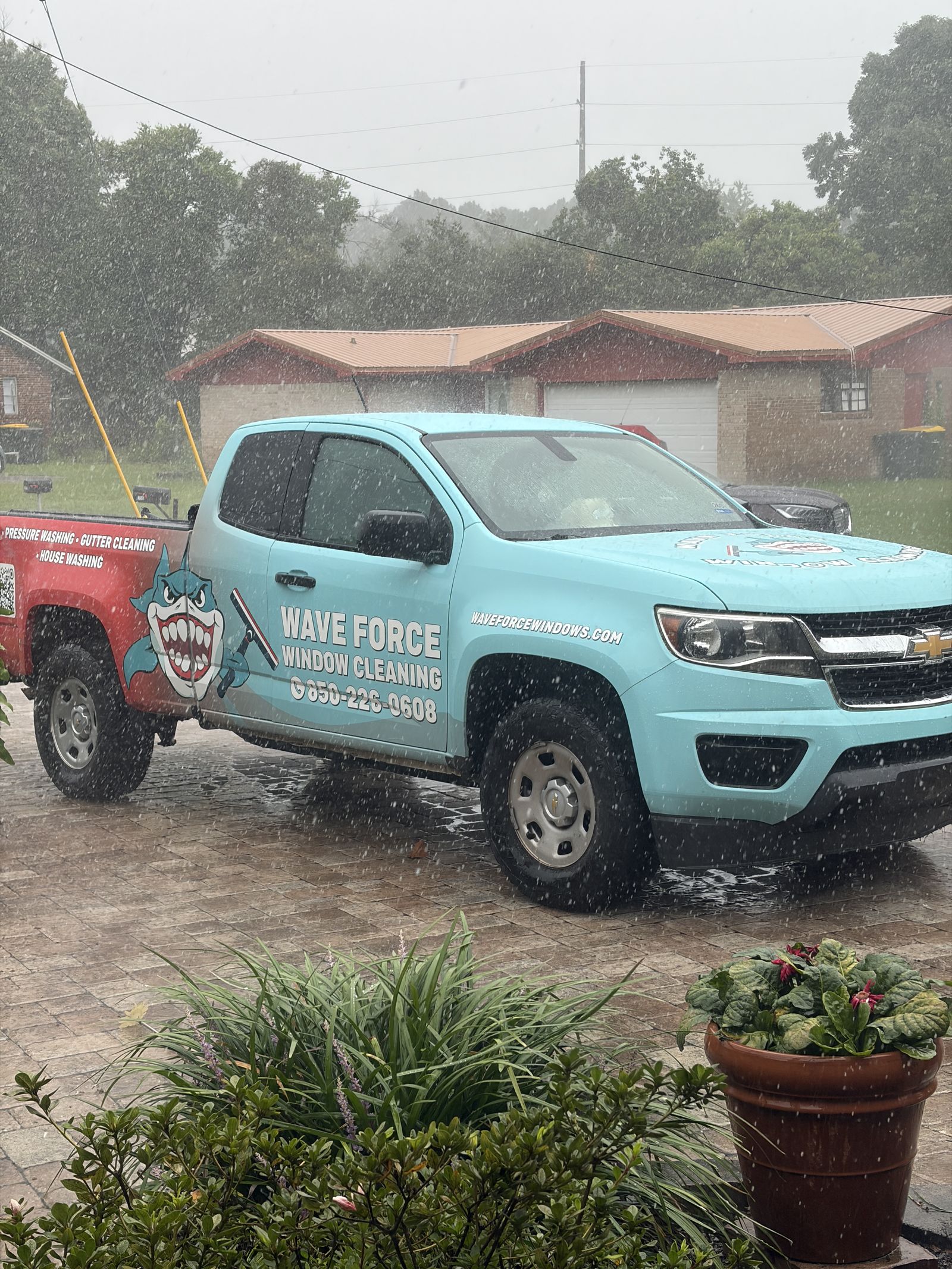 Wave Force Window Cleaning branded truck parked at a job site