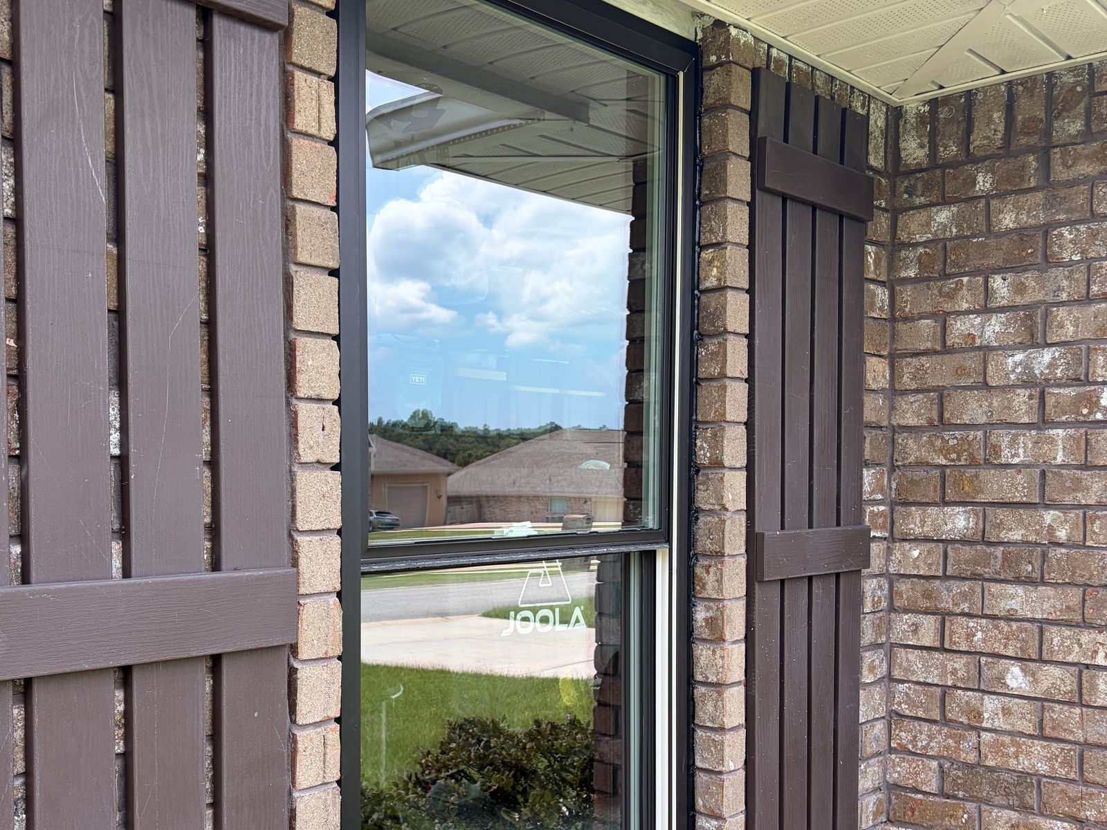 The same exterior window after professional window cleaning, glass spotless and clear